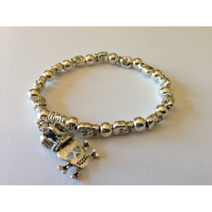 Skull and Crown charm on a Silver-Tone Skull and Beads Bracelet